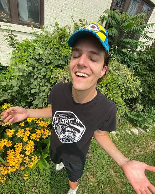 Dignan smelling the flowers